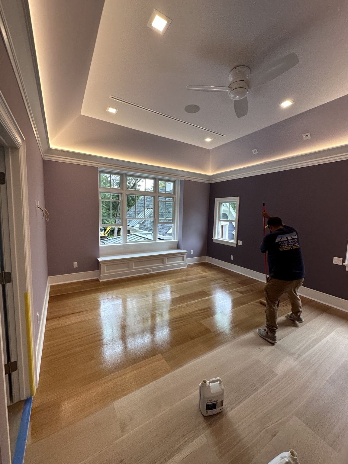 Light wood floor photographed during on-site finishing work