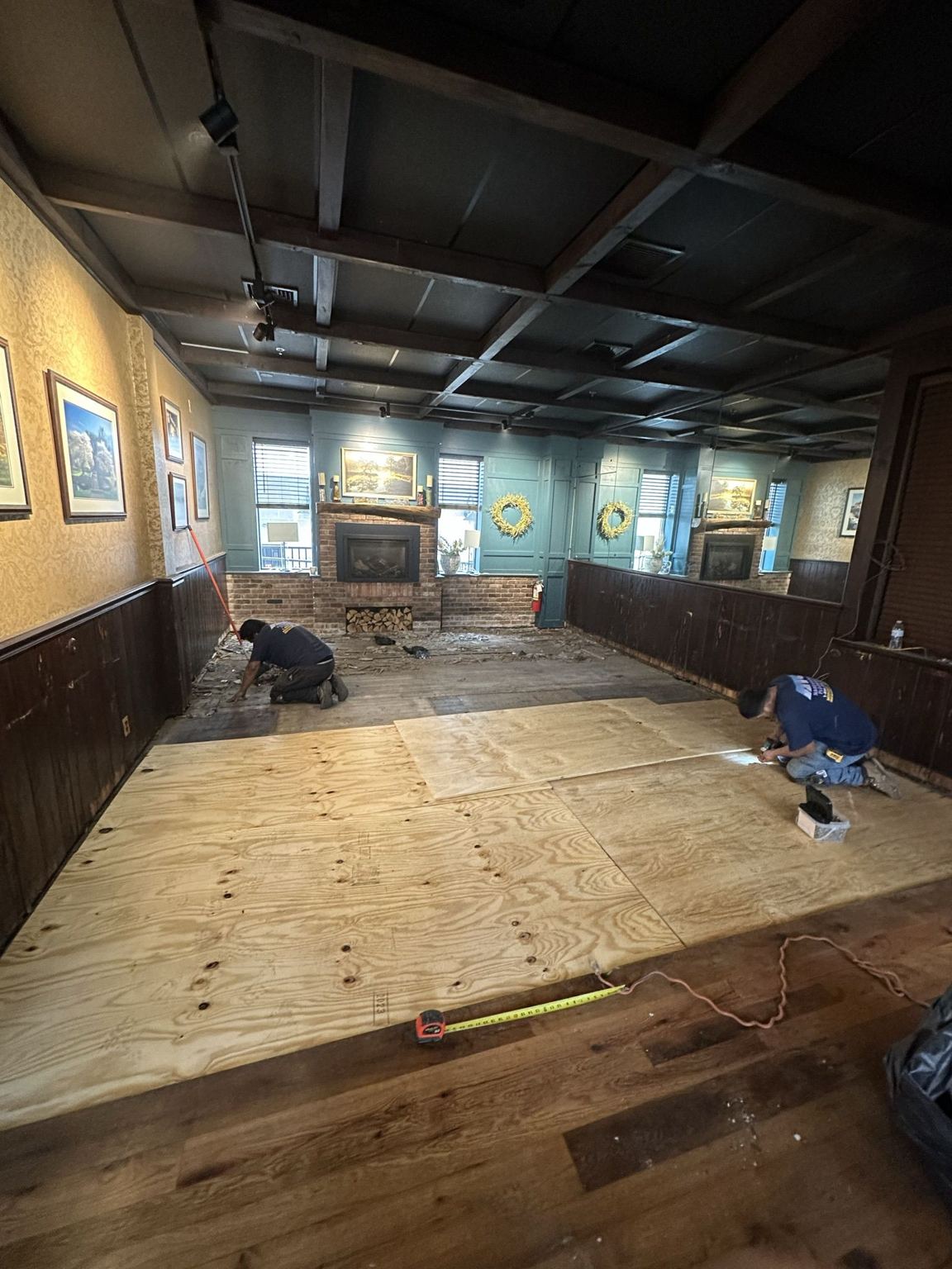 New plywood subfloor being fitted in the restaurant dining room